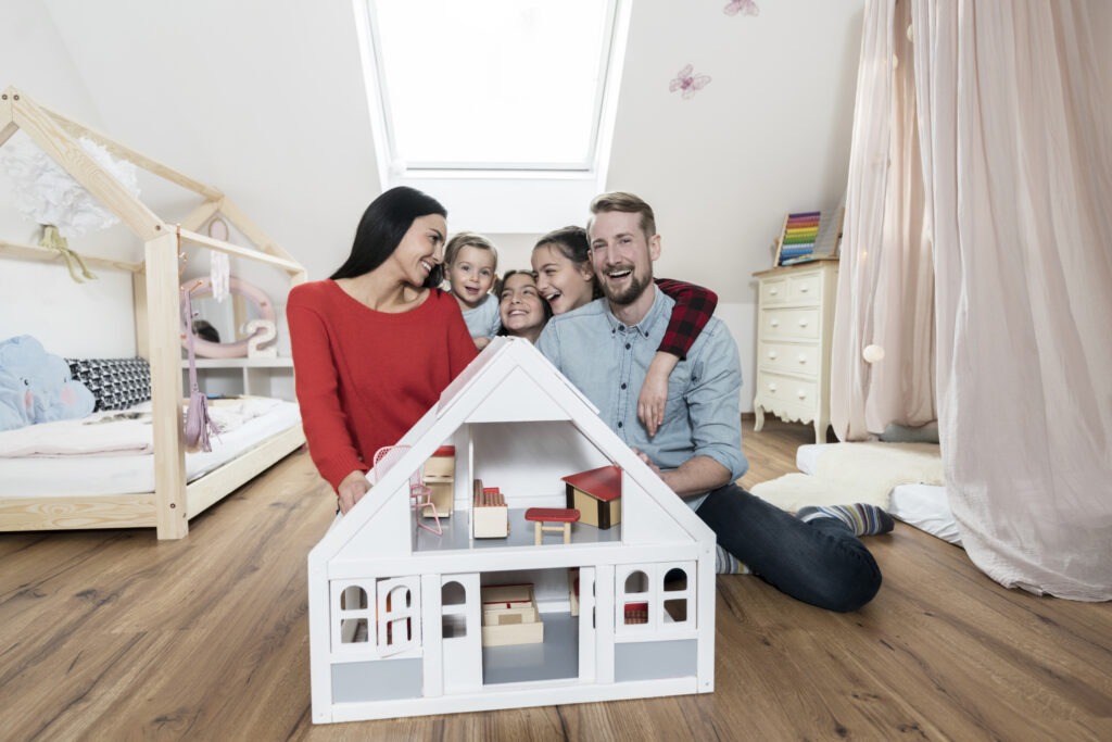 a happy family of 5 in a house